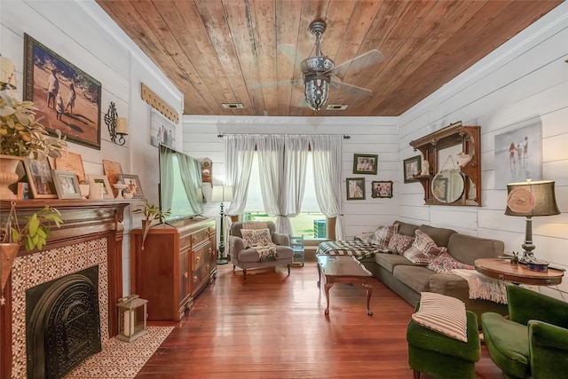 306 College St, Red Oak, TX 75154 - living area with wooden ceiling, a ceiling fan, hardwood / wood-style floors, wooden walls, and a fireplace