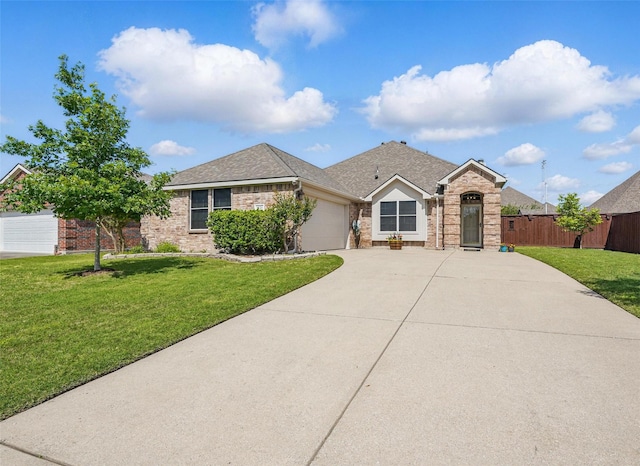 1121 Twin Lakes Dr, Wylie, TX 75098 - single story home featuring concrete driveway, brick siding, and an attached garage