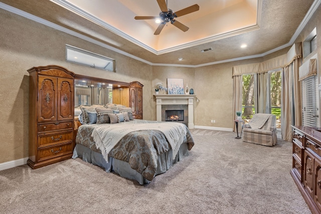 1405 Micah Way, Keller, TX 76248 - bedroom featuring a raised ceiling, crown molding, baseboards, carpet floors, and a tile fireplace
