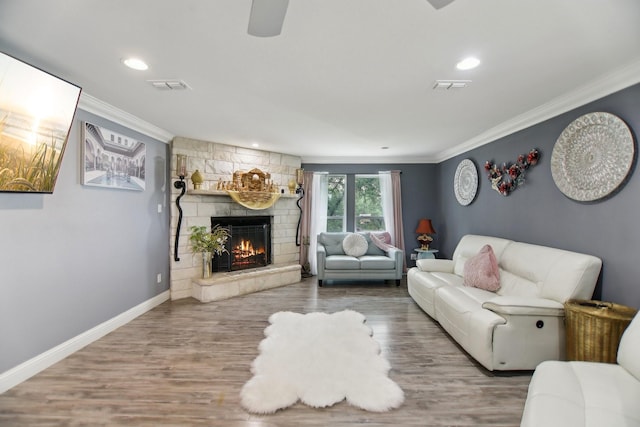 4711 W Wedgefield Rd, Granbury, TX 76049 - living room with crown molding, a stone fireplace, baseboards, wood finished floors, and ceiling fan