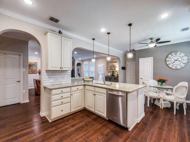 13026 Brook Ridge Dr, Frisco, TX 75035 - kitchen featuring arched walkways, dishwasher, a sink, ceiling fan, and ornamental molding