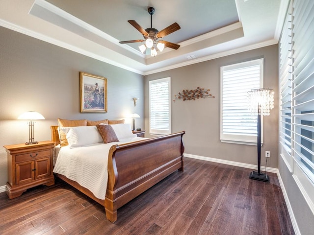 13026 Brook Ridge Dr, Frisco, TX 75035 - bedroom featuring a raised ceiling, crown molding, dark wood-style floors, and baseboards