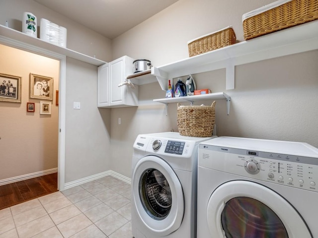 13026 Brook Ridge Dr, Frisco, TX 75035 - laundry area with separate washer and dryer, cabinet space, light tile patterned floors, and baseboards