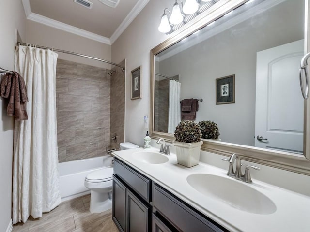 13026 Brook Ridge Dr, Frisco, TX 75035 - bathroom featuring toilet, ornamental molding, double vanity, and shower / bath combo