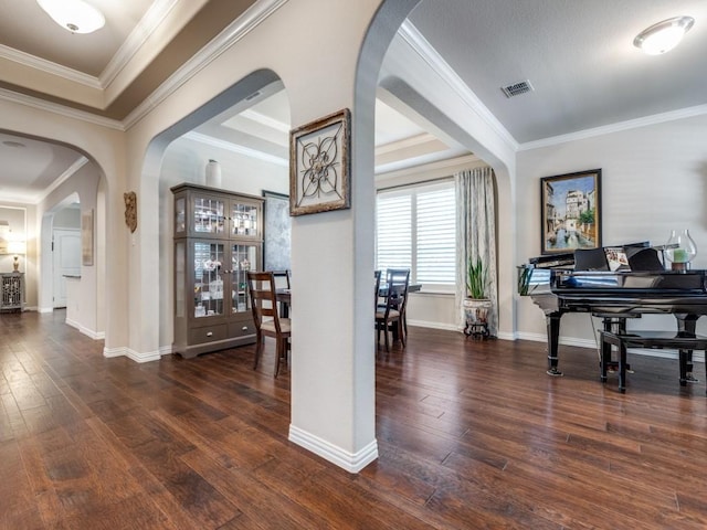 13026 Brook Ridge Dr, Frisco, TX 75035 - entryway featuring wood-type flooring, arched walkways, baseboards, and crown molding