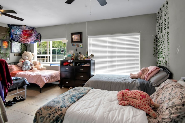 bedroom with tile patterned flooring and a ceiling fan