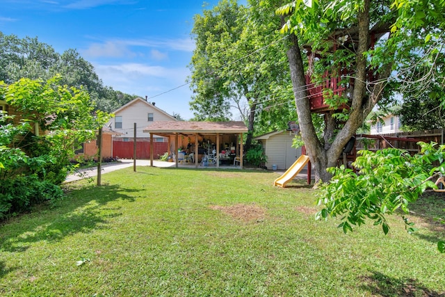 view of yard with a patio area and a playground