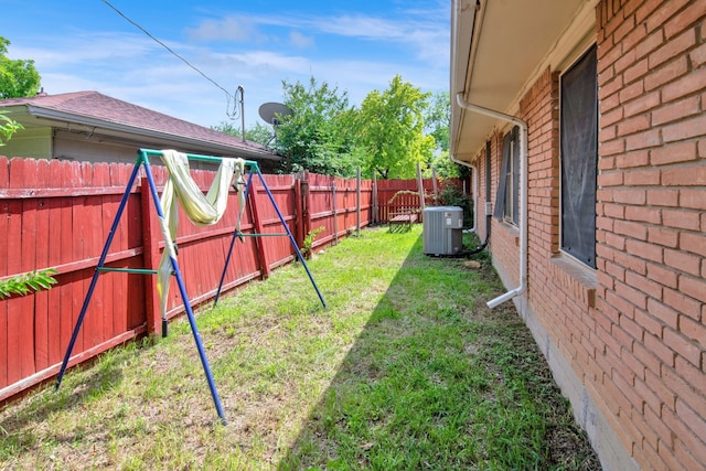 view of yard featuring central air condition unit