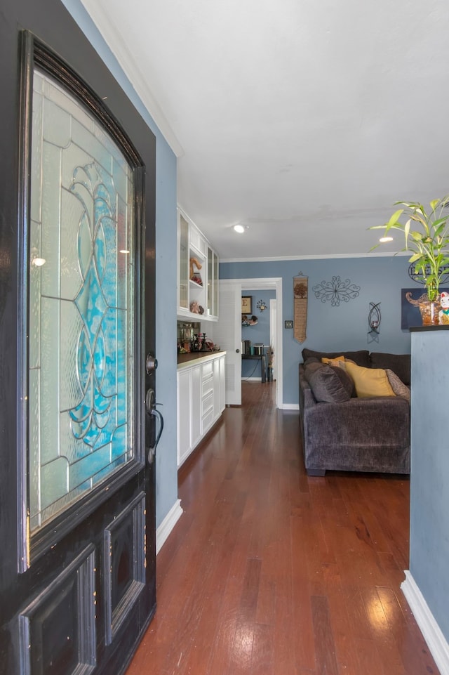 entrance foyer with dark wood-style floors, baseboards, crown molding, and recessed lighting