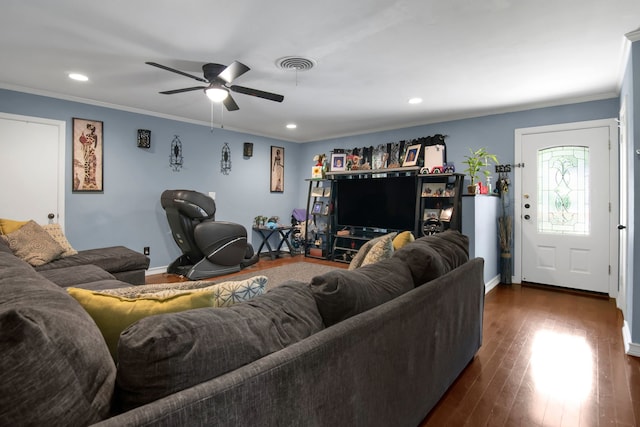 living area featuring ornamental molding, ceiling fan, dark wood-style flooring, recessed lighting, and baseboards