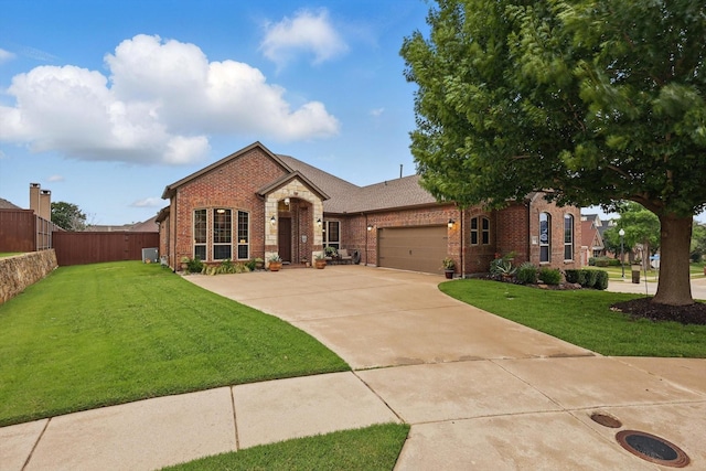 2801 Spring Oaks Dr, Highland Village, TX 75077 - view of front of home featuring brick siding, a garage, and driveway