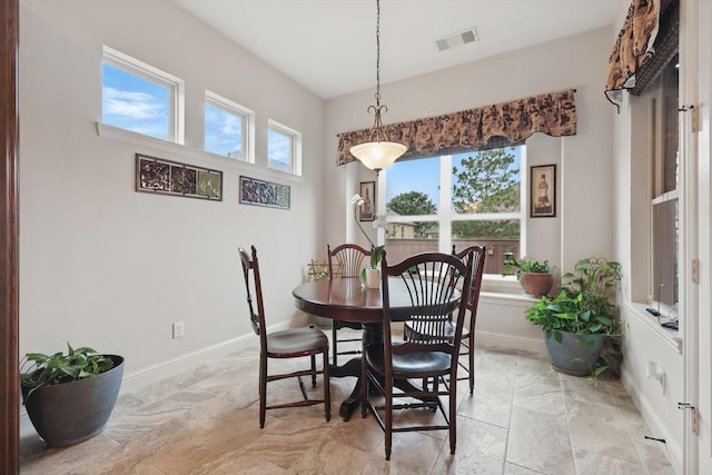 2801 Spring Oaks Dr, Highland Village, TX 75077 - dining space with baseboards and light stone finish flooring