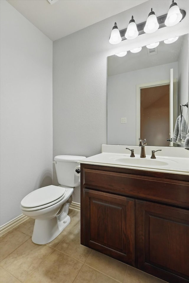 2801 Spring Oaks Dr, Highland Village, TX 75077 - half bathroom featuring tile patterned floors, toilet, vanity, and baseboards