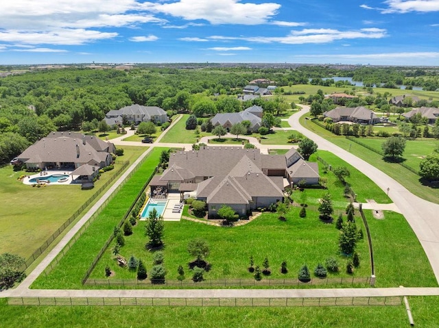 aerial perspective of suburban area featuring a pool area