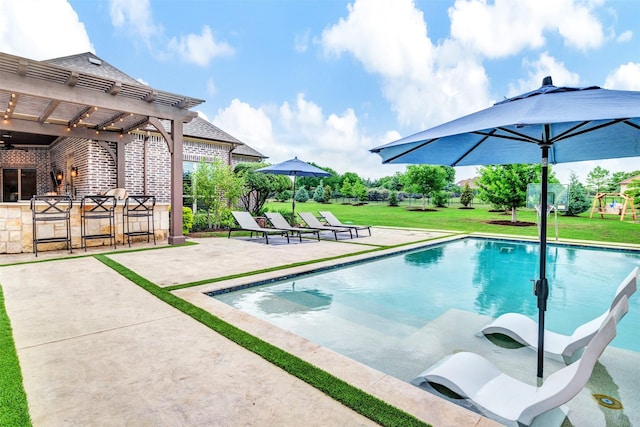 outdoor pool featuring a pergola, a patio, and a lawn