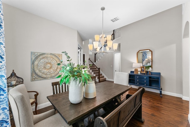 12092 Burnt Prairie Ln, Frisco, TX 75035 - dining area with baseboards, a chandelier, wood finished floors, and stairs