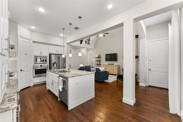 12092 Burnt Prairie Ln, Frisco, TX 75035 - kitchen with appliances with stainless steel finishes, a ceiling fan, a sink, white cabinets, and dark wood-style floors
