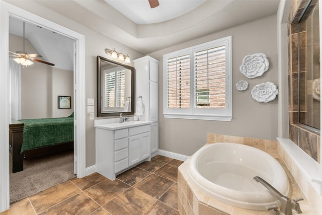 12092 Burnt Prairie Ln, Frisco, TX 75035 - bathroom with a ceiling fan, a garden tub, vanity, ensuite bathroom, and baseboards
