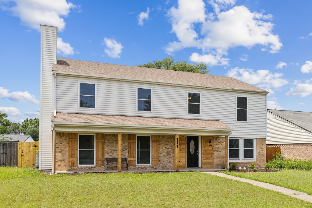 111 Southerland Ave, Mesquite, TX 75150 - traditional-style home featuring a chimney, a porch, brick siding, and a shingled roof