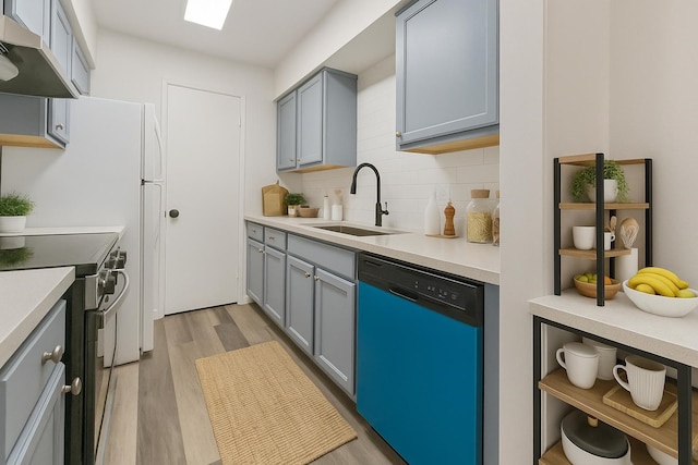 1811 E Grauwyler Rd Unit 138, Irving, TX 75061 - kitchen featuring dishwasher, under cabinet range hood, a sink, stainless steel electric range oven, and light wood finished floors
