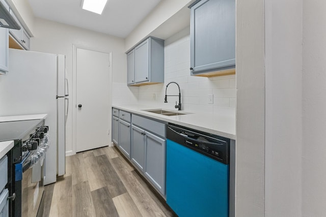 1811 E Grauwyler Rd Unit 138, Irving, TX 75061 - kitchen featuring dishwasher, a sink, electric range oven, light wood-type flooring, and backsplash