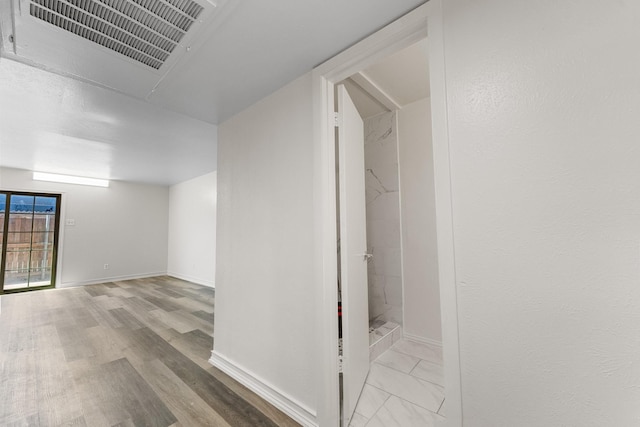1811 E Grauwyler Rd Unit 138, Irving, TX 75061 - hall with baseboards and wood finished floors