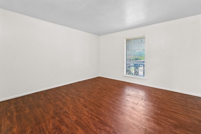 1811 E Grauwyler Rd Unit 138, Irving, TX 75061 - unfurnished room with wood finished floors and baseboards