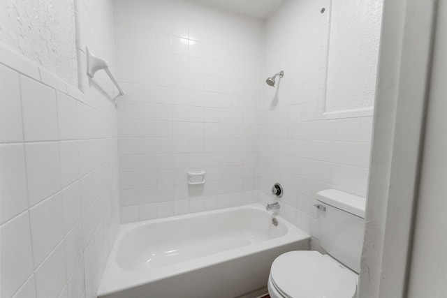 1811 E Grauwyler Rd Unit 138, Irving, TX 75061 - bathroom with toilet, tile walls, and shower / bathtub combination