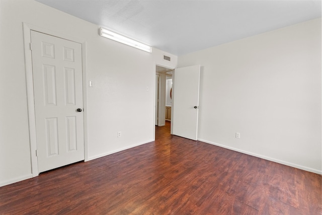 1811 E Grauwyler Rd Unit 138, Irving, TX 75061 - unfurnished bedroom featuring wood finished floors and baseboards