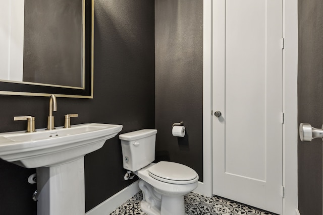 2921 Citation Rd, Celina, TX 75009 - half bath featuring baseboards, toilet, and tile patterned floors