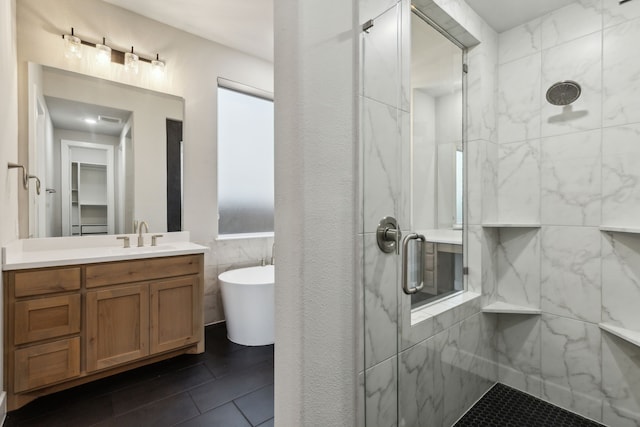 2921 Citation Rd, Celina, TX 75009 - full bath featuring a marble finish shower, a freestanding tub, vanity, tile patterned floors, and tile walls