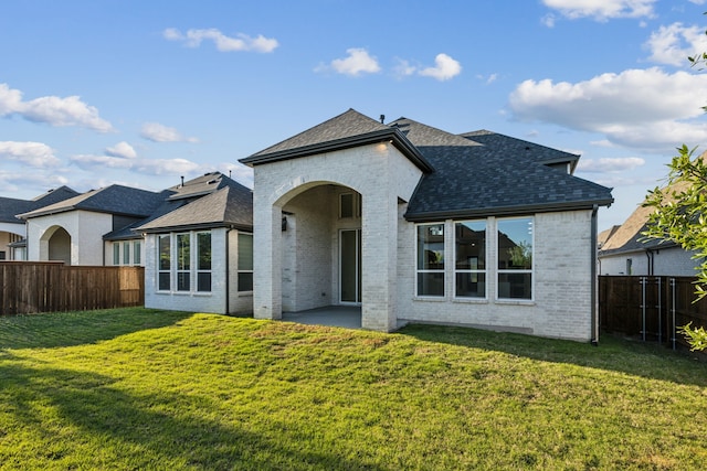 2921 Citation Rd, Celina, TX 75009 - rear view of house featuring brick siding, a shingled roof, and a patio area