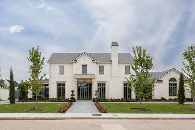 5610 Lobello, Dallas, TX 75229 - view of front of house featuring a front lawn and a chimney