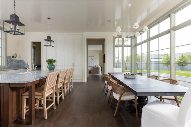 5610 Lobello, Dallas, TX 75229 - dining area featuring dark wood-type flooring and a chandelier