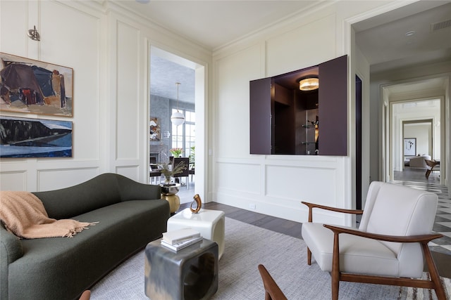 5610 Lobello, Dallas, TX 75229 - living room featuring a decorative wall, wood finished floors, and ornamental molding
