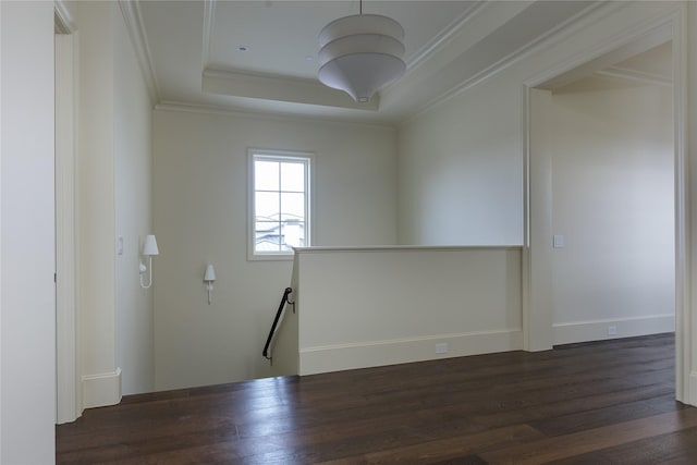 5610 Lobello, Dallas, TX 75229 - empty room with a raised ceiling, dark wood-type flooring, and ornamental molding