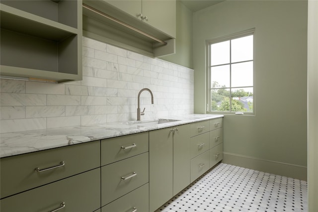 5610 Lobello, Dallas, TX 75229 - kitchen featuring open shelves, baseboards, tasteful backsplash, light flooring, and light stone counters