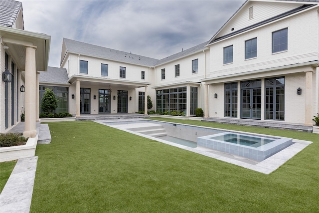 5610 Lobello, Dallas, TX 75229 - back of house featuring a yard and a pool with connected hot tub