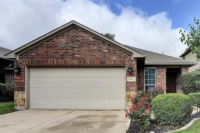 5061 Britton Ridge Ln, Fort Worth, TX 76179 - ranch-style house with brick siding, concrete driveway, an attached garage, and roof with shingles