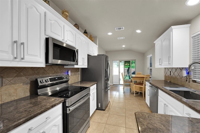 5061 Britton Ridge Ln, Fort Worth, TX 76179 - kitchen with stainless steel appliances, a sink, recessed lighting, white cabinetry, and backsplash