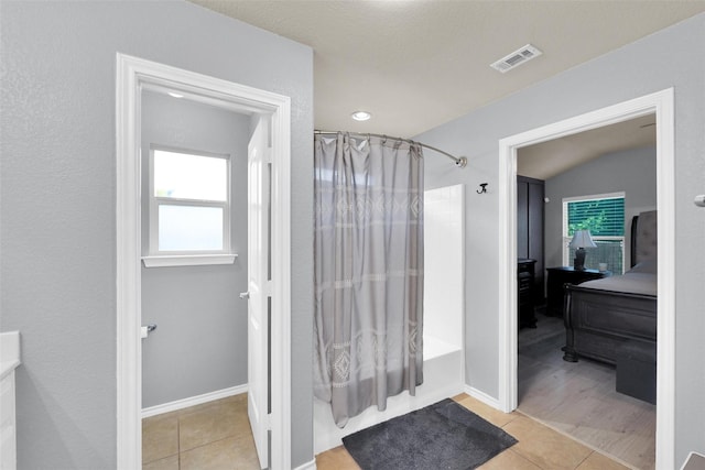 5061 Britton Ridge Ln, Fort Worth, TX 76179 - full bath featuring tile patterned floors, plenty of natural light, shower / bathtub combination with curtain, and connected bathroom
