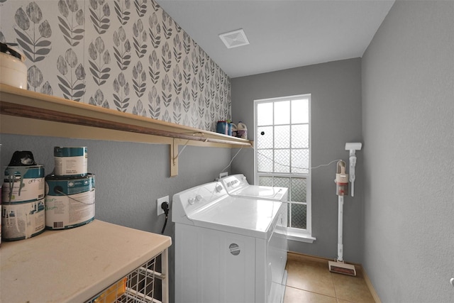 5061 Britton Ridge Ln, Fort Worth, TX 76179 - washroom featuring independent washer and dryer, light tile patterned floors, baseboards, and a textured wall