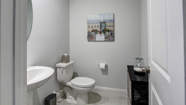 7436 Palisades Dr, Rowlett, TX 75088 - half bath with baseboards, toilet, and tile patterned flooring