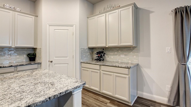 7436 Palisades Dr, Rowlett, TX 75088 - kitchen featuring decorative backsplash, wood finished floors, and baseboards
