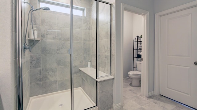 7436 Palisades Dr, Rowlett, TX 75088 - bathroom featuring a stall shower, toilet, and tile patterned floors