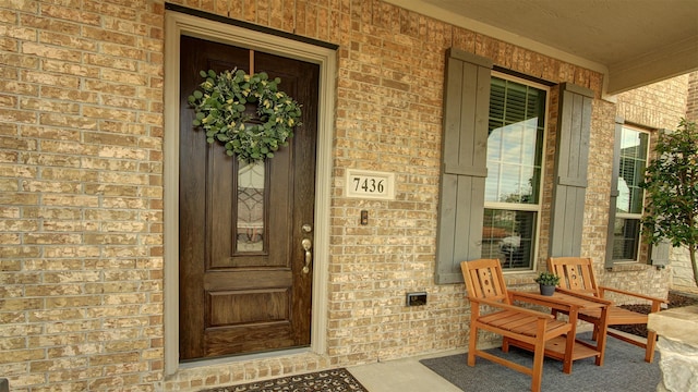7436 Palisades Dr, Rowlett, TX 75088 - entrance to property featuring covered porch and brick siding