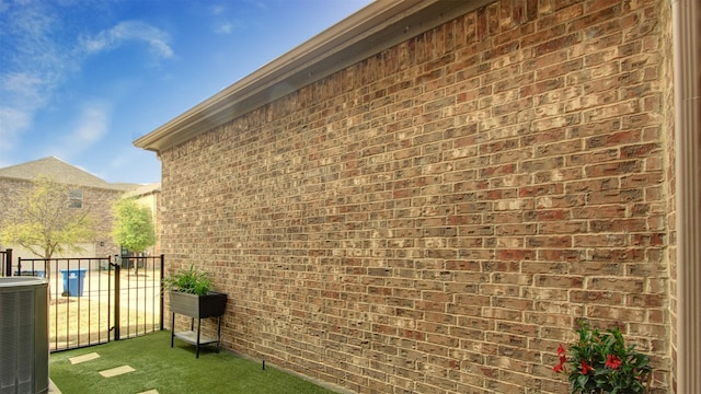 7436 Palisades Dr, Rowlett, TX 75088 - view of side of home with central air condition unit and brick siding