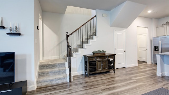 7436 Palisades Dr, Rowlett, TX 75088 - stairs featuring wood finished floors, baseboards, and recessed lighting