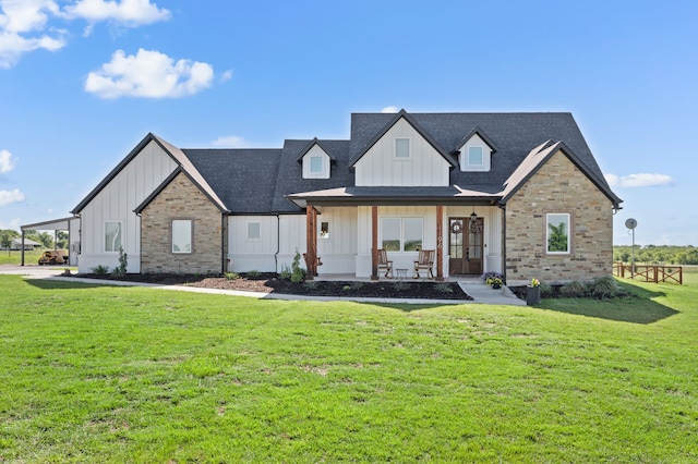 1196 Smith Rd, Ponder, TX 76259 - modern inspired farmhouse featuring board and batten siding, a front yard, french doors, and brick siding