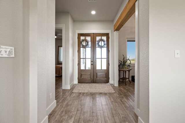1196 Smith Rd, Ponder, TX 76259 - entryway featuring french doors, wood finished floors, baseboards, recessed lighting, and a textured wall
